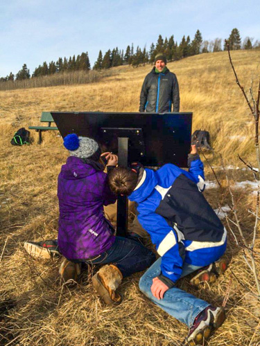 Students installing interpretive sign at Beauvais Lake Provincial Park